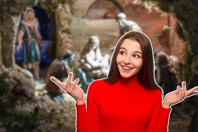 ragazza sorpresa e presepe sullo sfondo